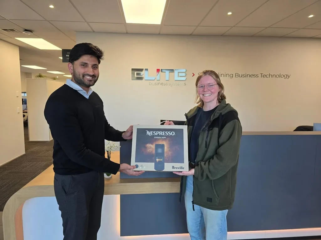 Bethany from Hope Rising Farm receiving the prize for the phishing challenge from BlueChip IT