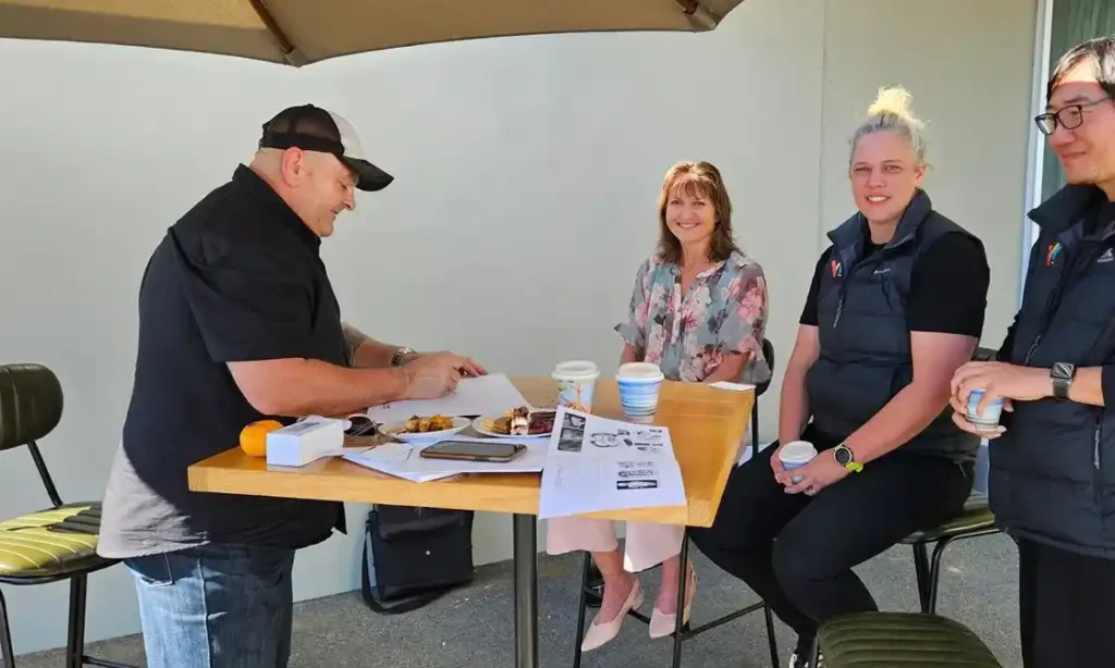 Caricaturist Darren Blomfield drawing live caricatures at Elite Open Day 2026 Hamilton