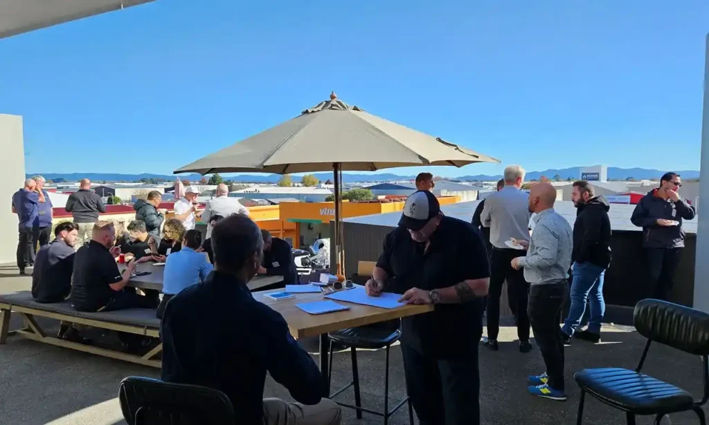 Caricaturist Darren Blomfield drawing live caricatures at Elite Open Day 2026 Hamilton