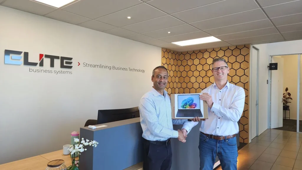 Scott receiving his Microsoft Surface Laptop prize at Elite Open Day 2026 Hamilton